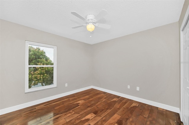 spare room with hardwood / wood-style floors, a textured ceiling, and ceiling fan