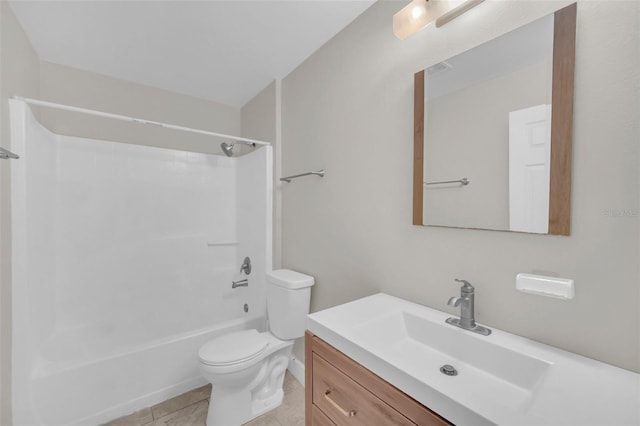 full bathroom featuring washtub / shower combination, vanity, toilet, and tile patterned flooring