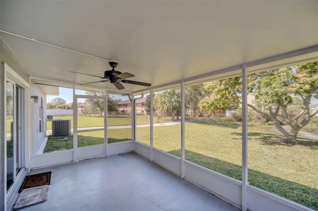 unfurnished sunroom featuring ceiling fan