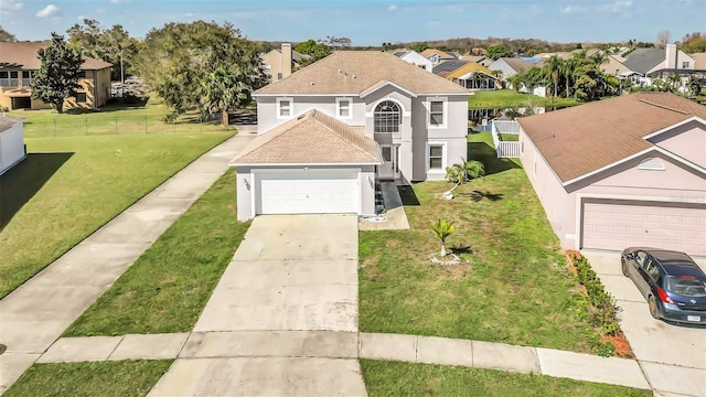 view of front facade with a garage and a front yard