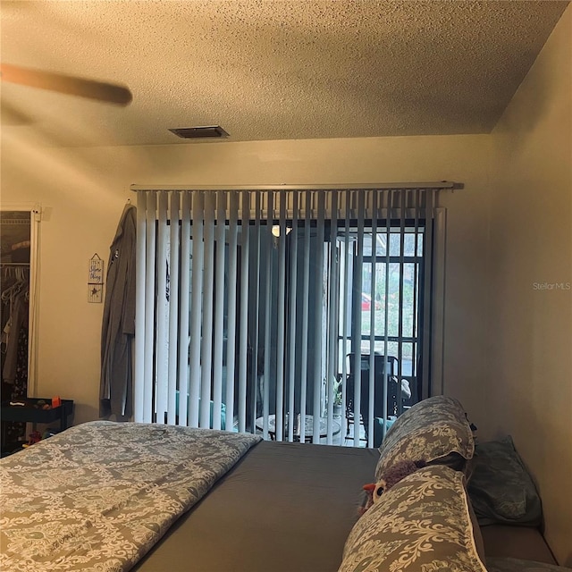 bedroom featuring a textured ceiling