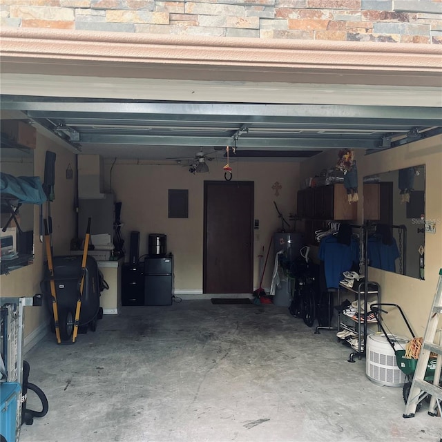 garage with electric panel and refrigerator