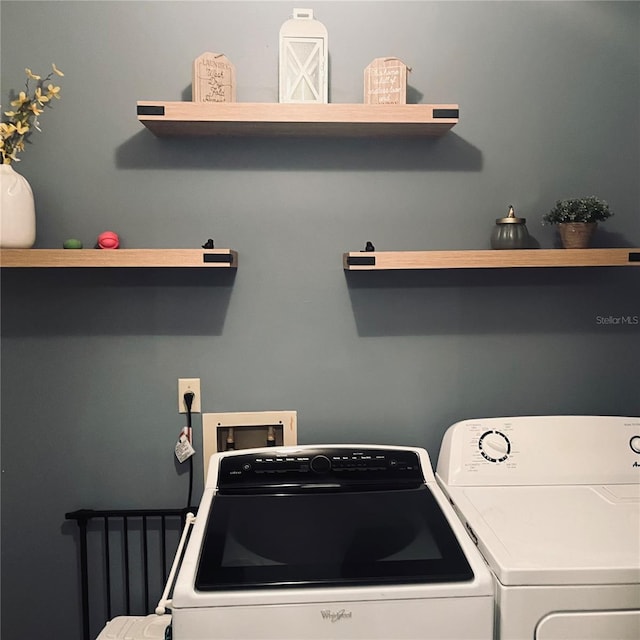 laundry room with washer and clothes dryer