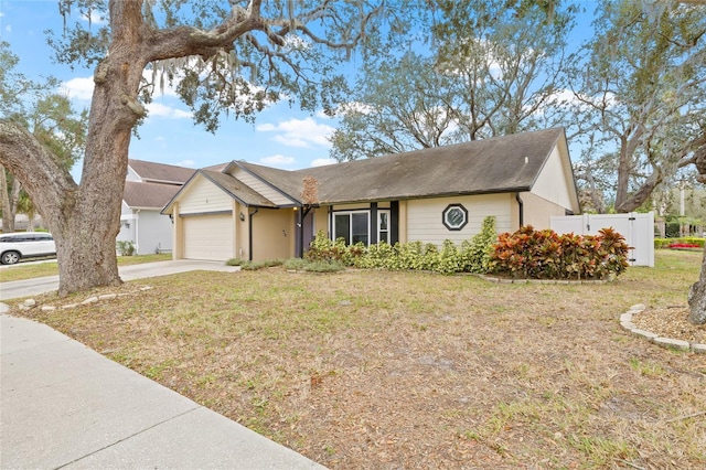 view of front of house featuring a garage and a front yard