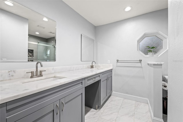 bathroom with vanity and an enclosed shower