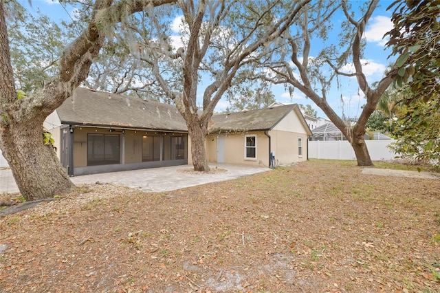 rear view of property with a patio area