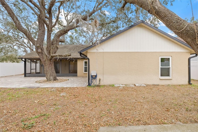 rear view of property featuring a patio area