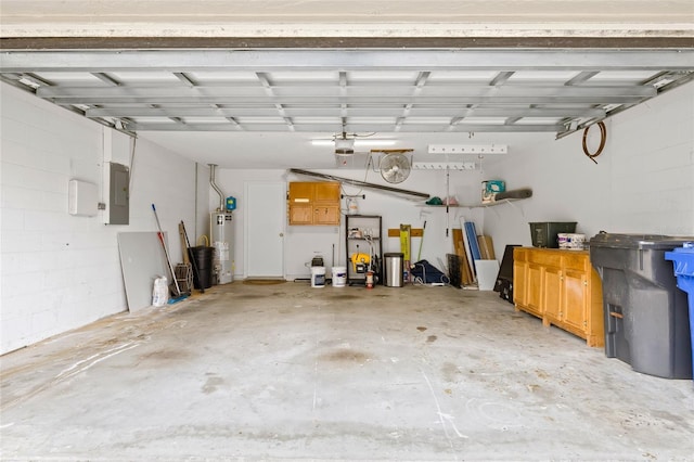 garage with gas water heater and electric panel