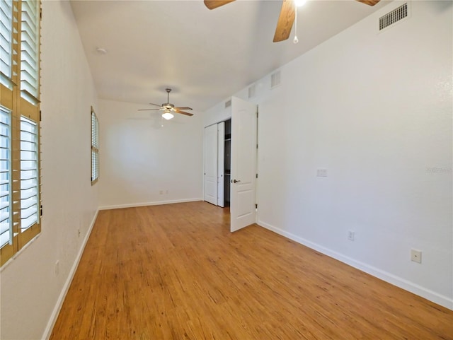 unfurnished room featuring ceiling fan and light wood-type flooring