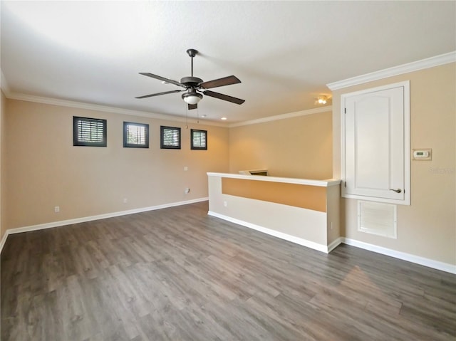 unfurnished room featuring crown molding, ceiling fan, and dark hardwood / wood-style flooring