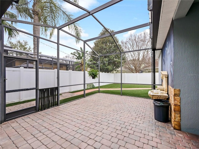 view of patio featuring a lanai