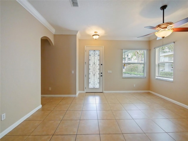 foyer entrance featuring ornamental molding, light tile patterned floors, and ceiling fan