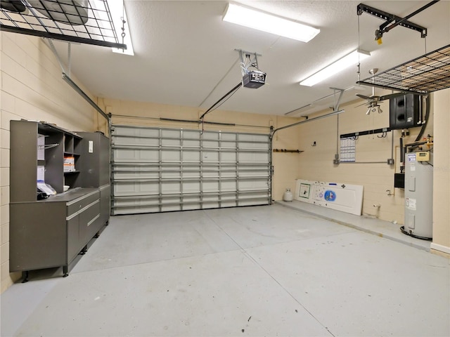 garage with a garage door opener and electric water heater