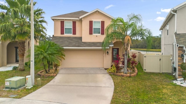 view of front of property featuring a garage and a front lawn