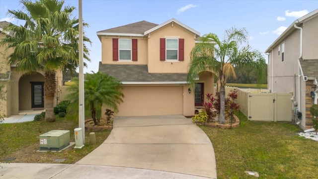 view of front of home with a garage and a front yard