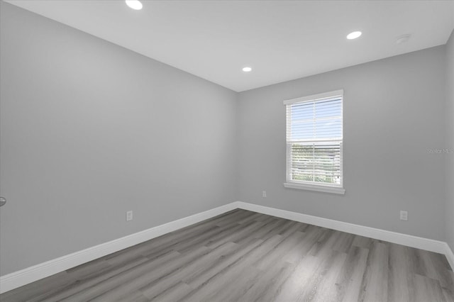 unfurnished room featuring light hardwood / wood-style floors