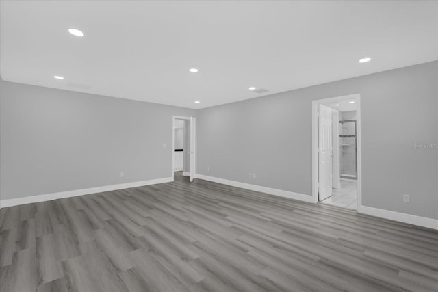 spare room featuring light wood-type flooring