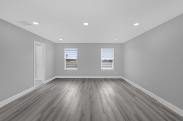 spare room with light hardwood / wood-style flooring