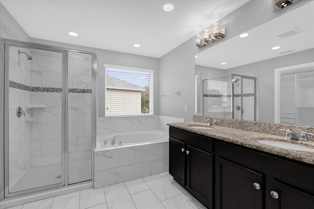 bathroom featuring vanity and separate shower and tub