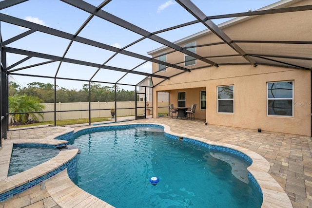 view of swimming pool featuring a lanai and a patio