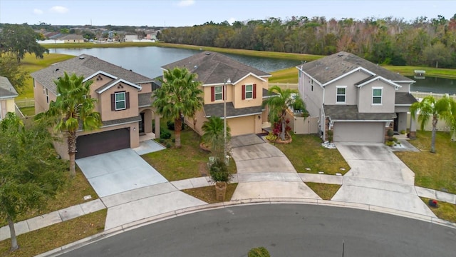 birds eye view of property with a water view