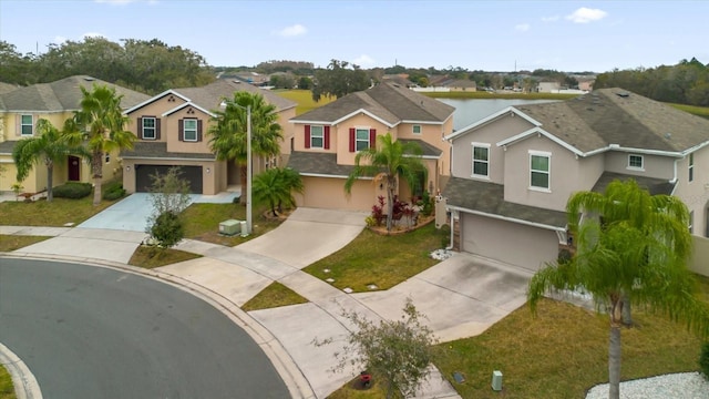 view of front of house with a garage and a front lawn