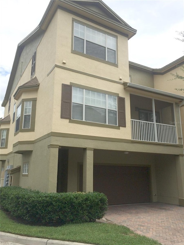 view of side of home with a garage