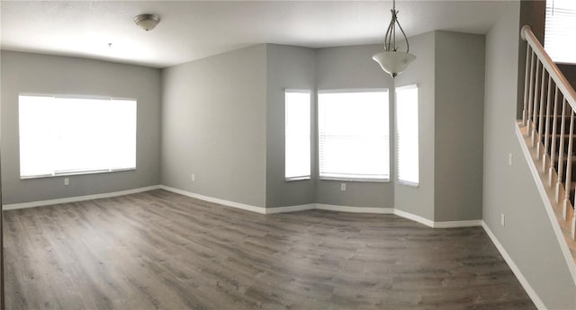 empty room with dark wood-type flooring