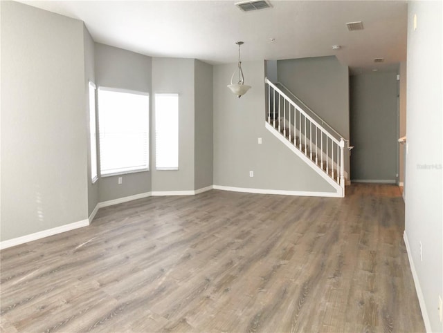 spare room with hardwood / wood-style floors