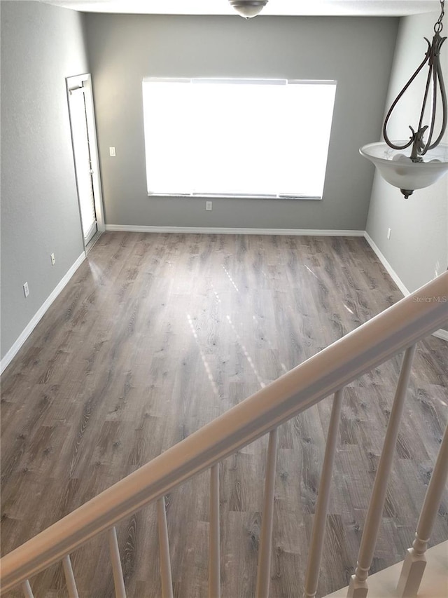 spare room with dark wood-type flooring