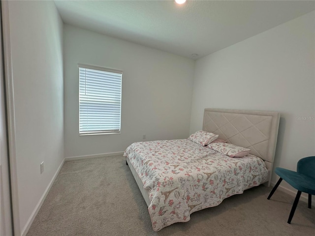 bedroom with light colored carpet