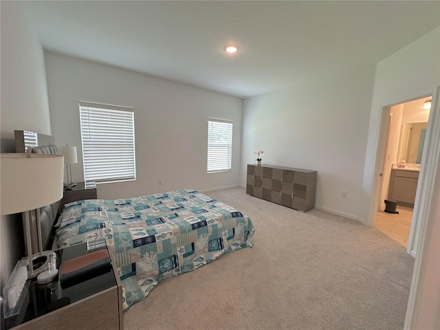 bedroom with light colored carpet