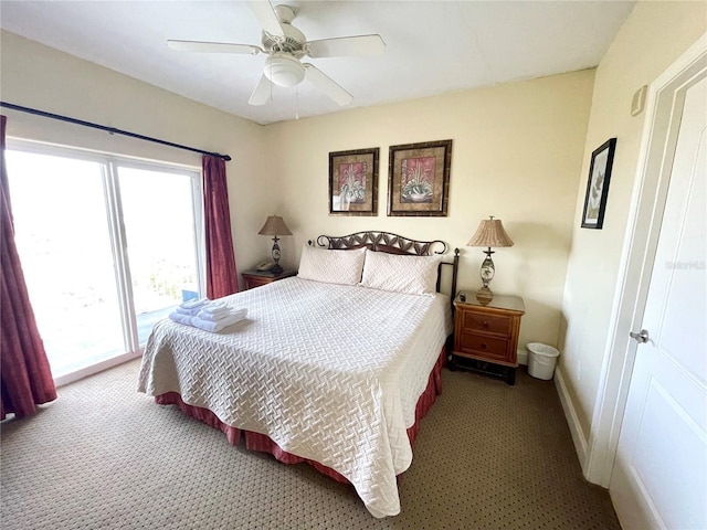 carpeted bedroom featuring ceiling fan and access to exterior