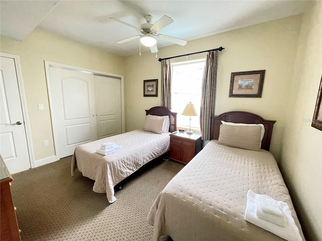 carpeted bedroom with a closet and ceiling fan