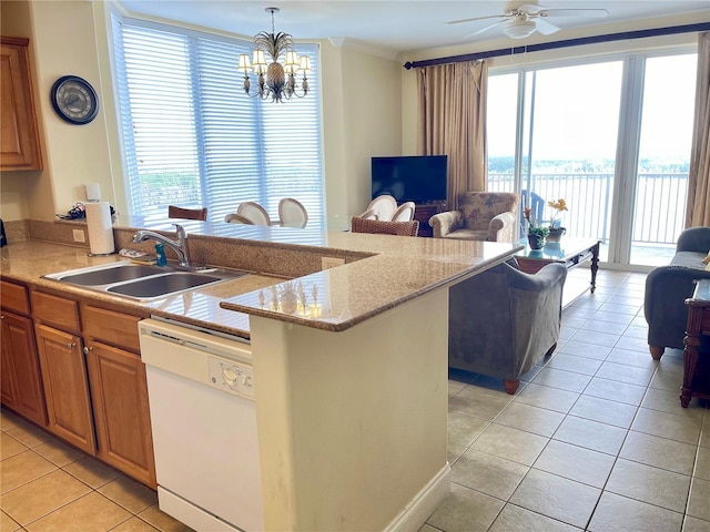 kitchen with light tile patterned flooring, dishwasher, an island with sink, sink, and hanging light fixtures