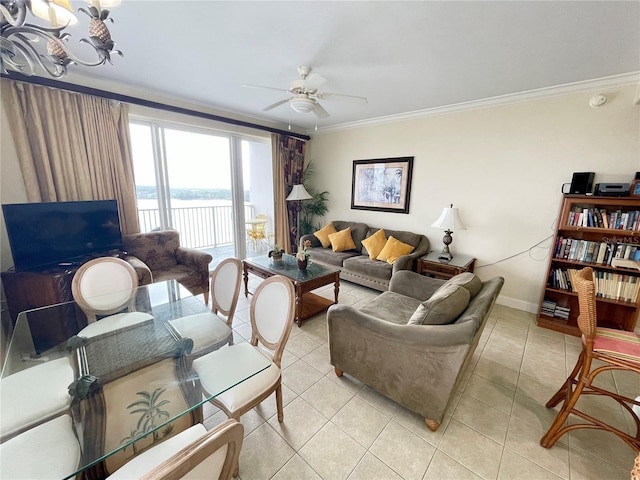 living room with light tile patterned flooring, ceiling fan, and crown molding