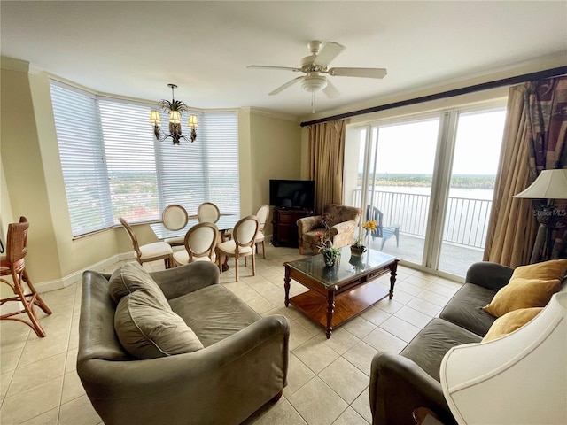 living room with ornamental molding, ceiling fan with notable chandelier, and light tile patterned floors