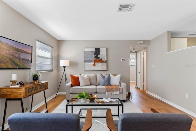 living room with light hardwood / wood-style floors