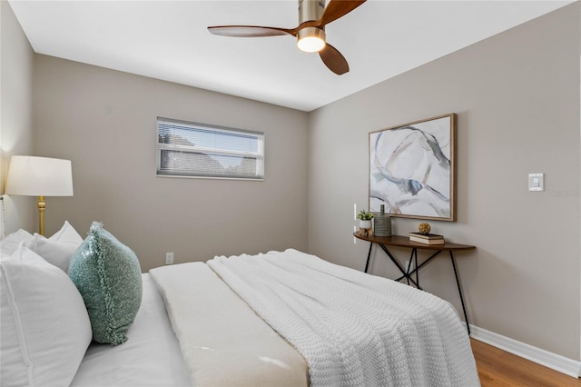 bedroom with wood-type flooring and ceiling fan