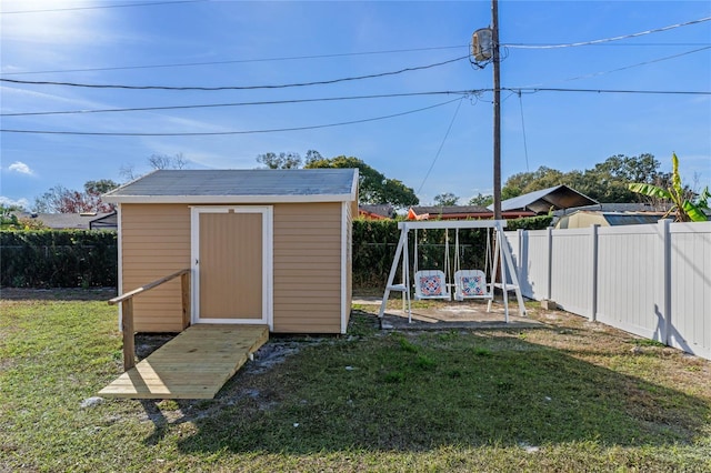 view of outbuilding featuring a yard