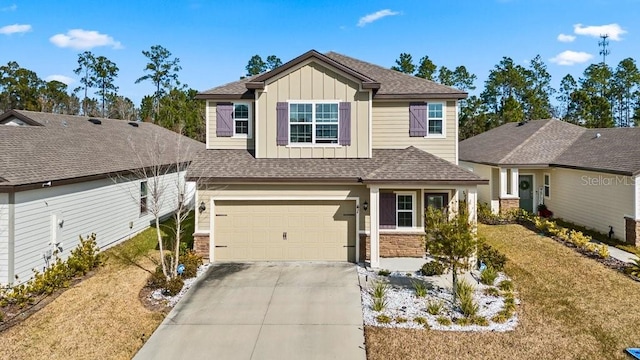 craftsman-style house with a garage and a front yard