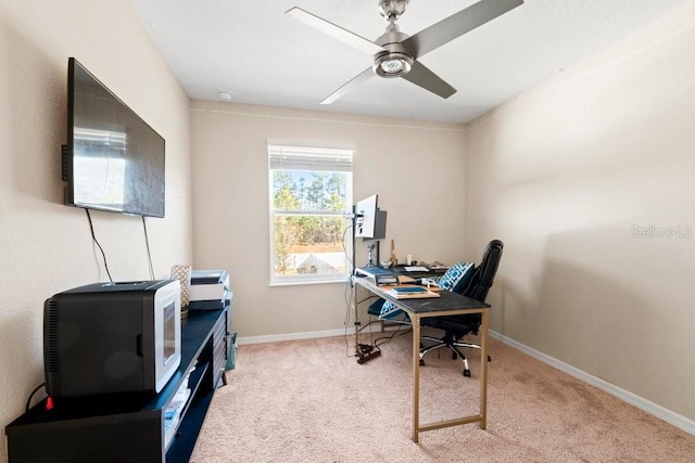 office area featuring ceiling fan and light colored carpet