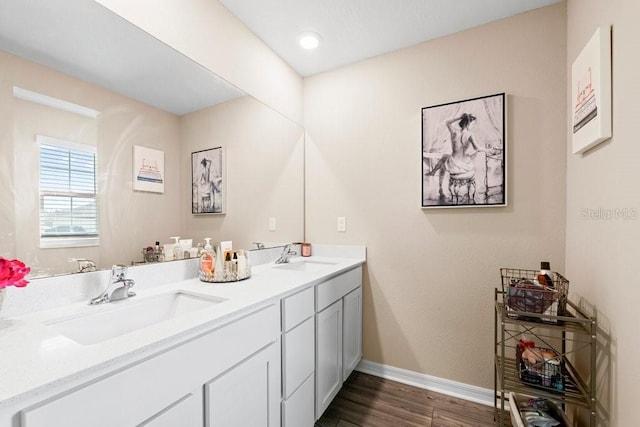 bathroom with vanity and wood-type flooring