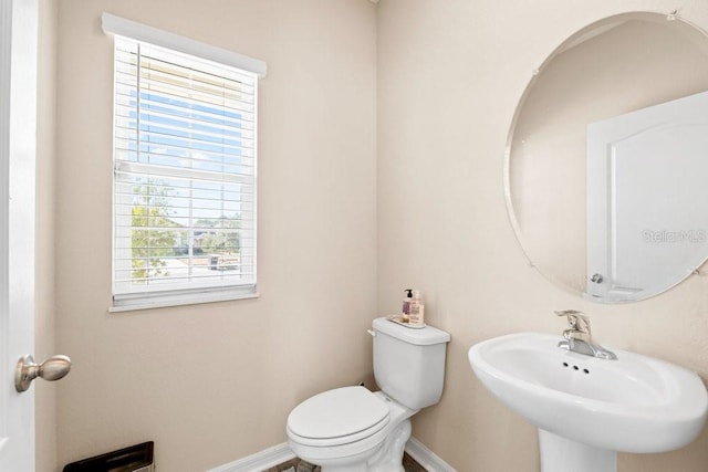 bathroom with sink and toilet