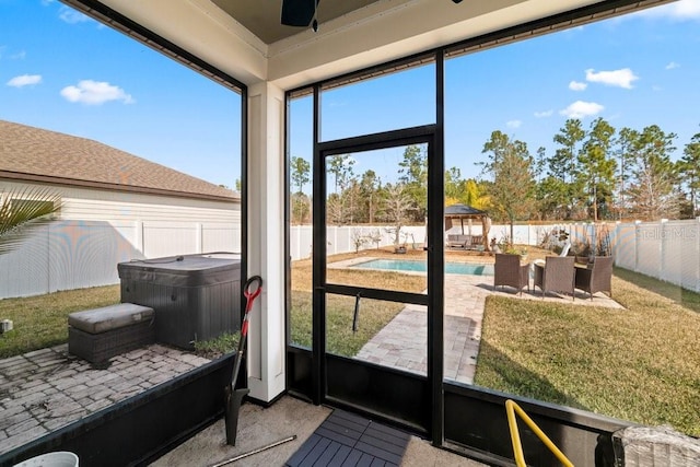 sunroom / solarium with ceiling fan