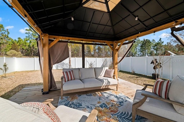 view of patio / terrace with a gazebo, an outdoor hangout area, and a wooden deck