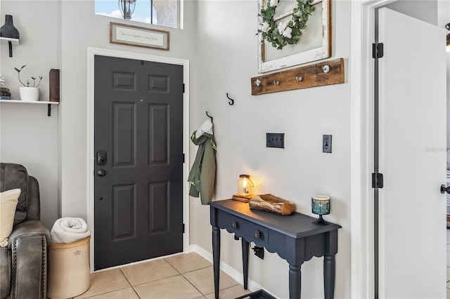 foyer featuring light tile patterned flooring