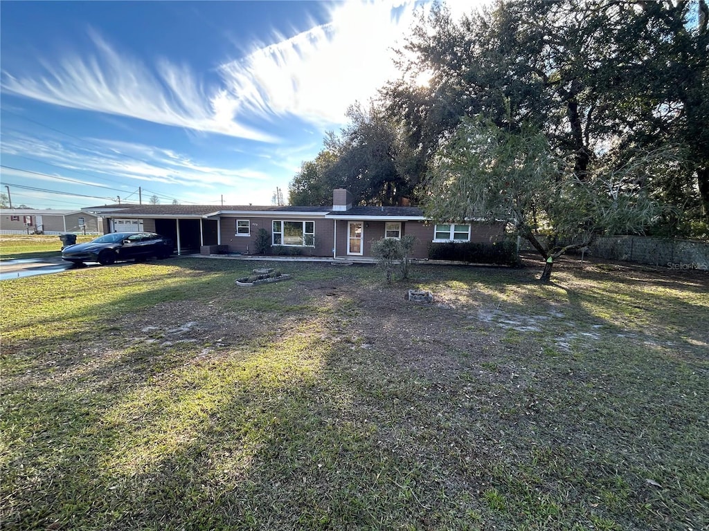 single story home with a front yard