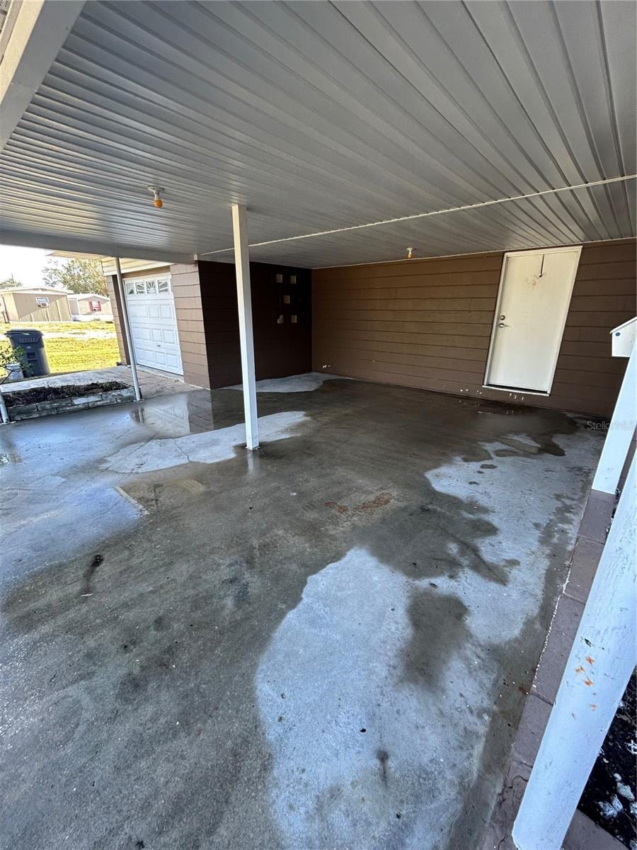 garage featuring a carport