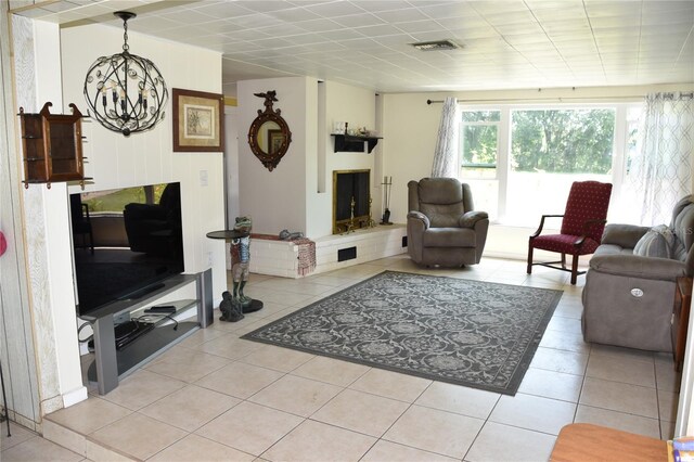 423 Longfellow Blvd, Lakeland, FL 33801 - living room featuring a chandelier and light tile patterned flooring